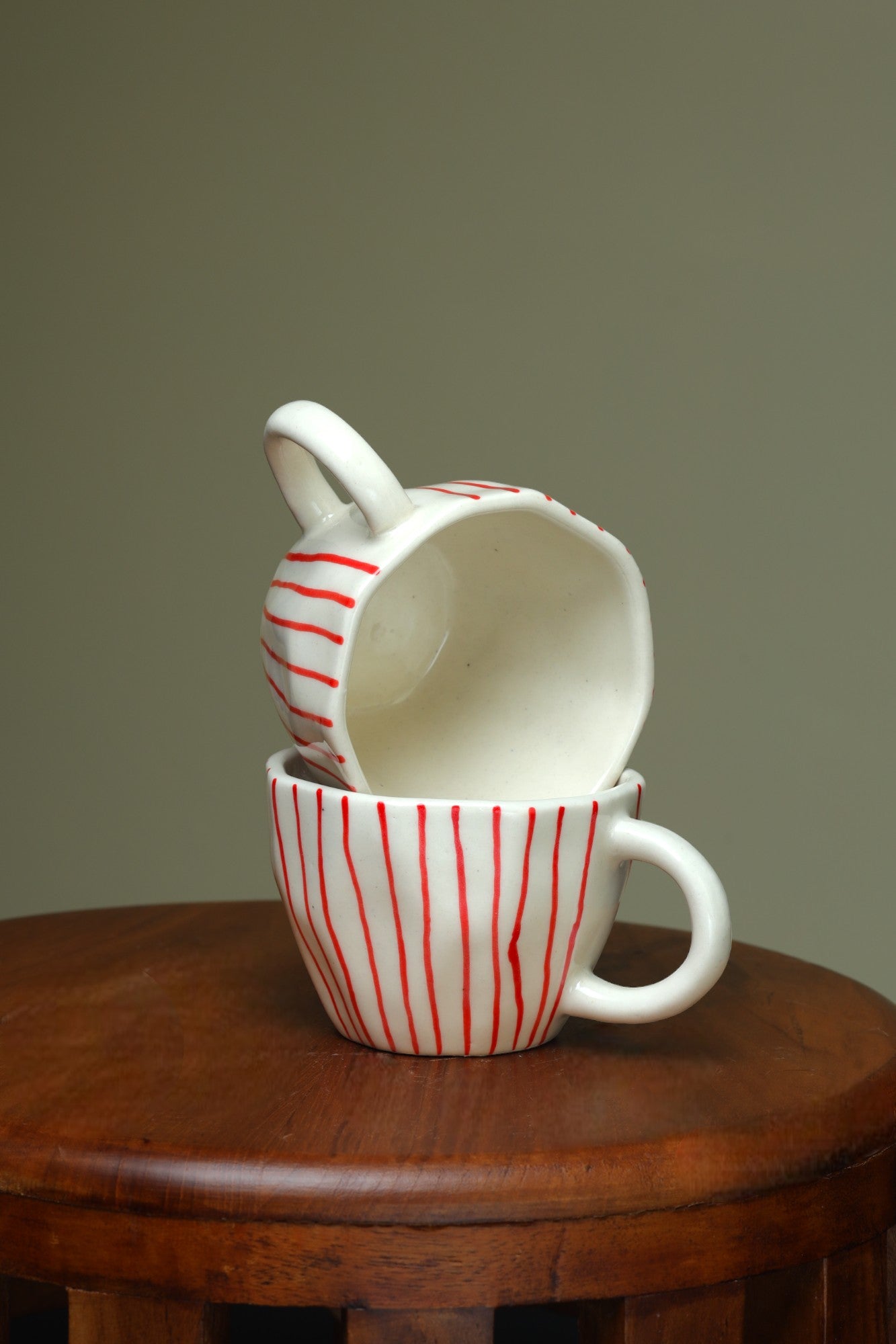 Artistic White Cups with Vertical Red Lines