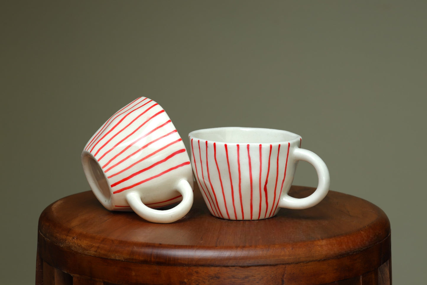 Artistic White Cups with Vertical Red Lines