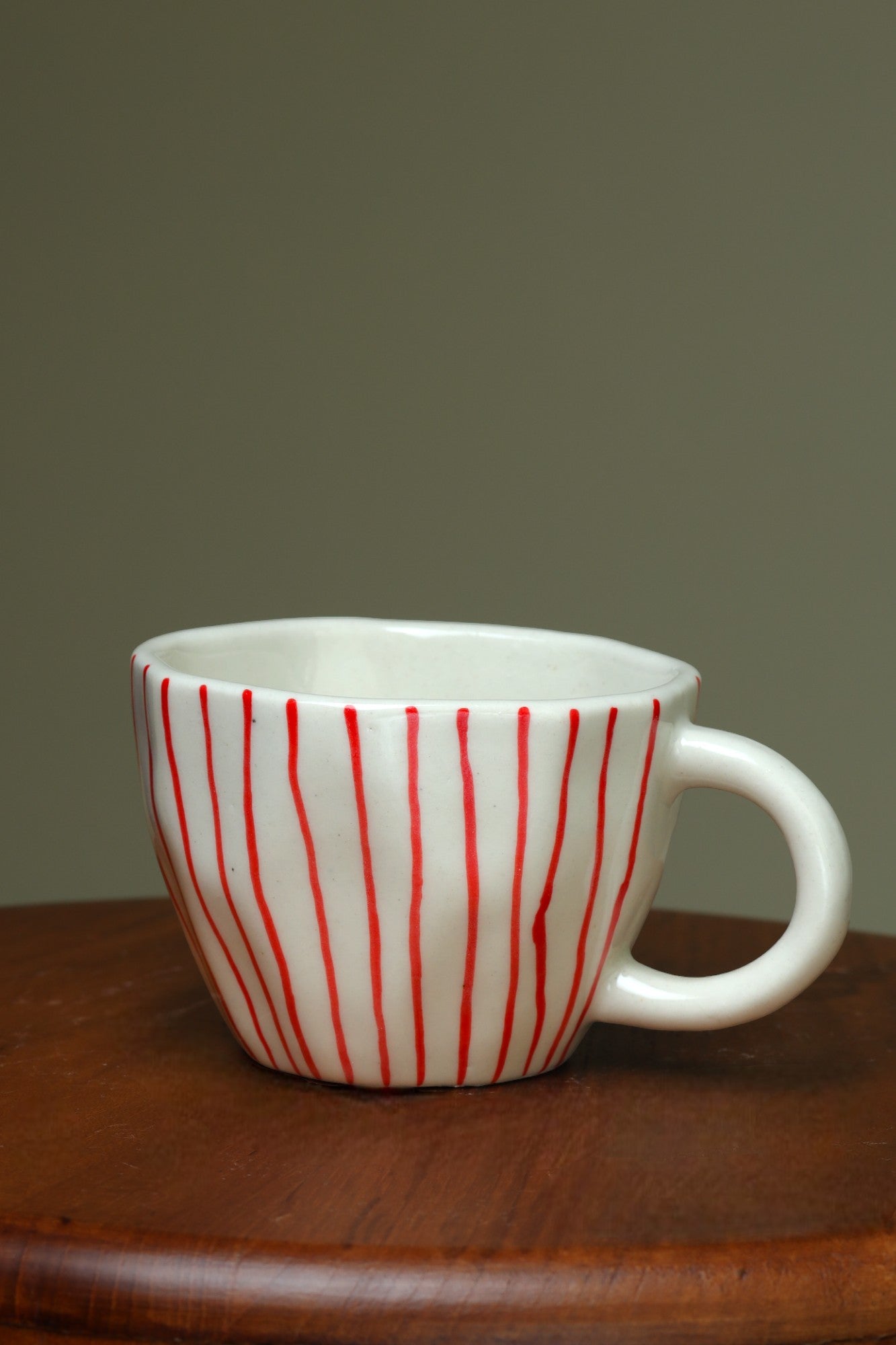 Artistic White Cups with Vertical Red Lines