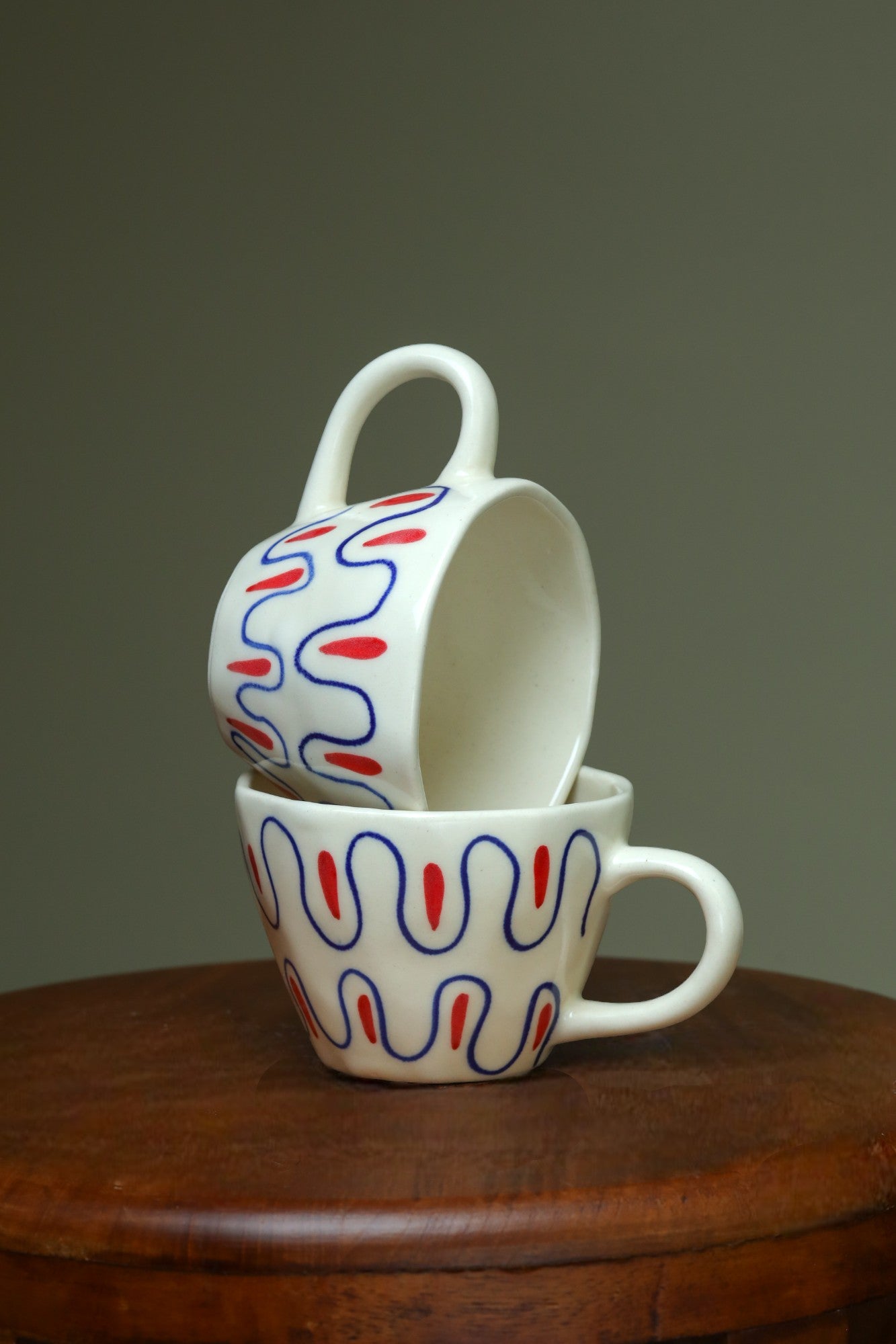 Exclusive white cups with blue and red art