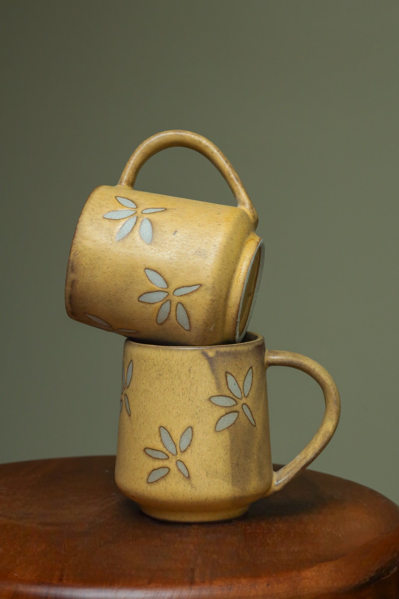 Antique brown mugs with flowers