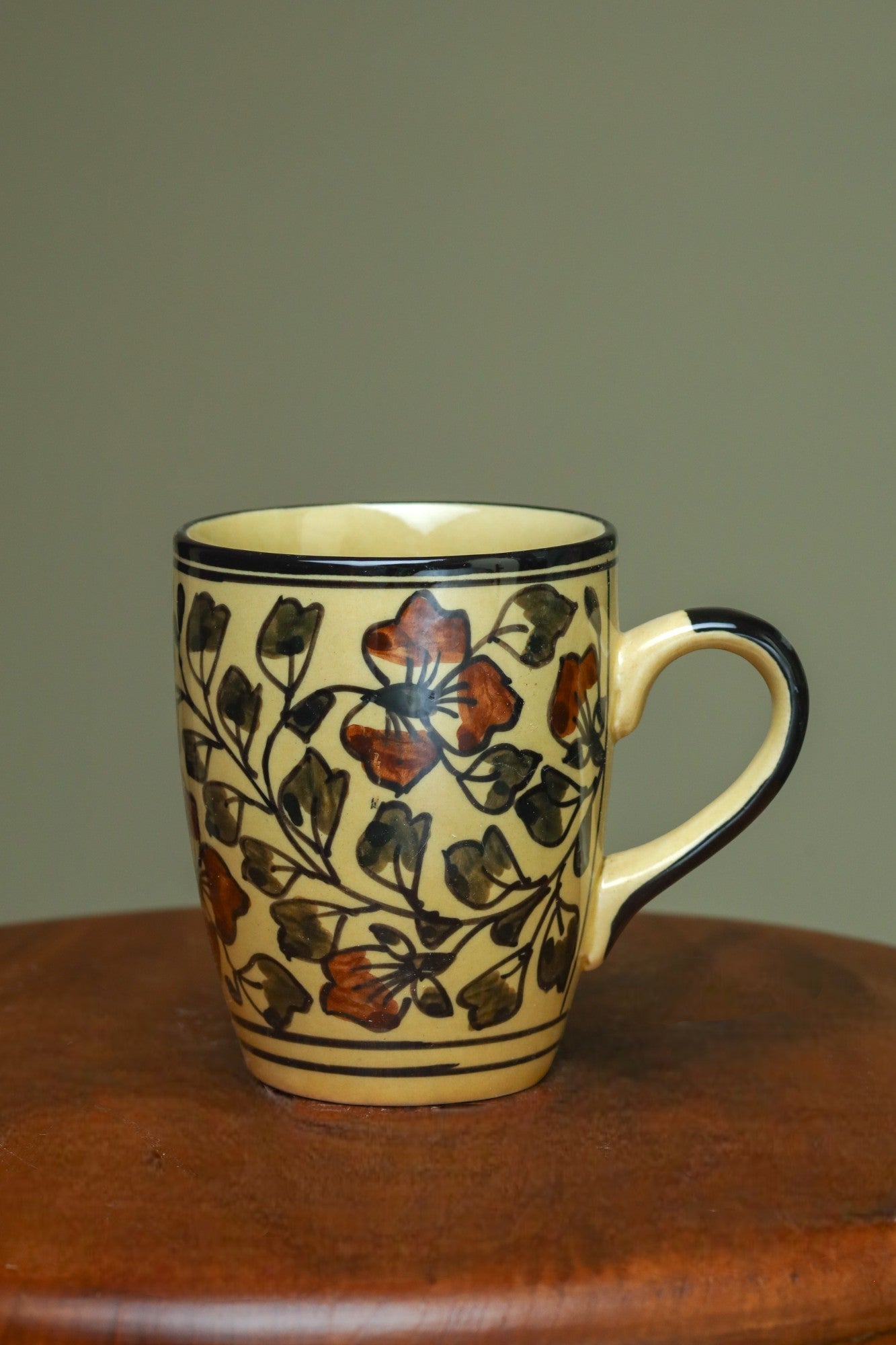Elegant yellow mug with floral design