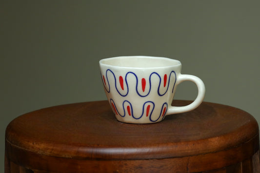Exclusive white cups with blue and red art