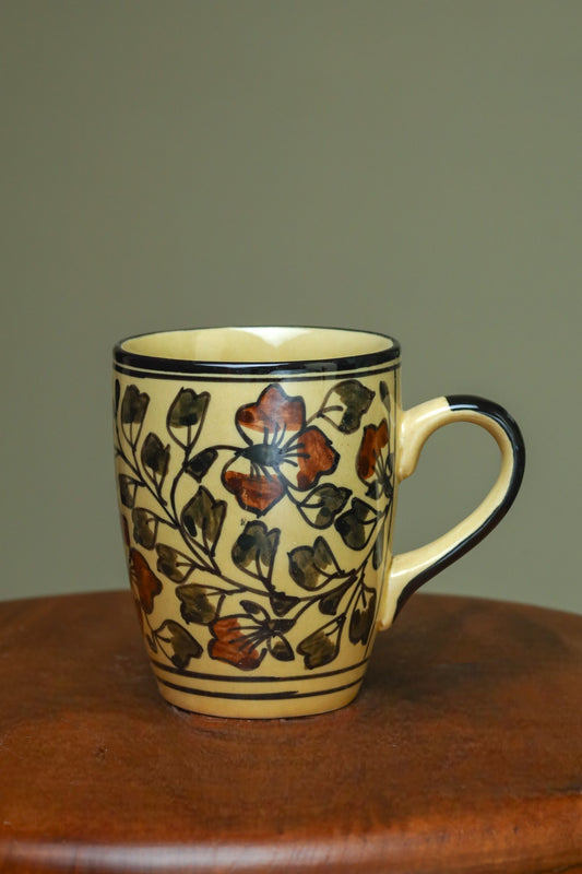 Elegant yellow mug with floral design