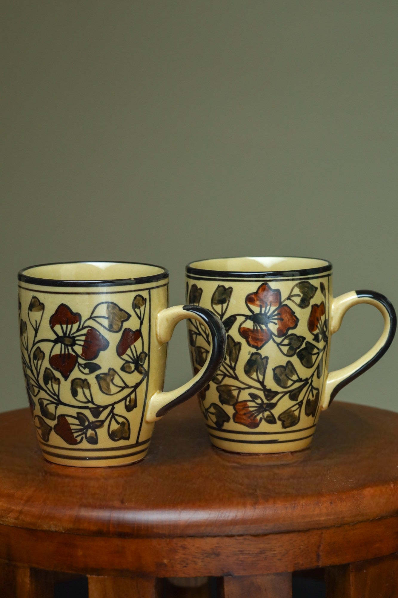 Elegant yellow mug with floral design